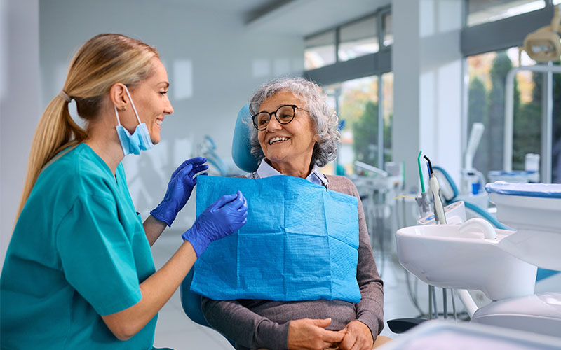 Griesbach Dental - Dentist talking to their patient about gum disease