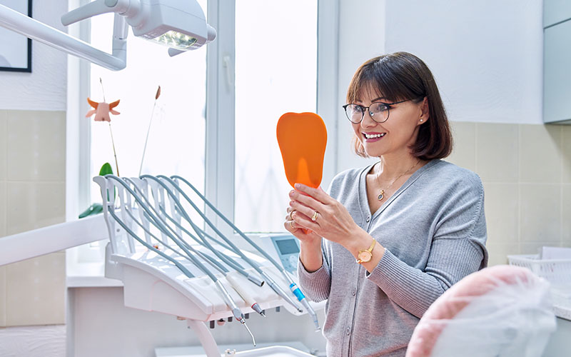 Griesbach Dental - Dentist talking to their patient about whitening their teeth
